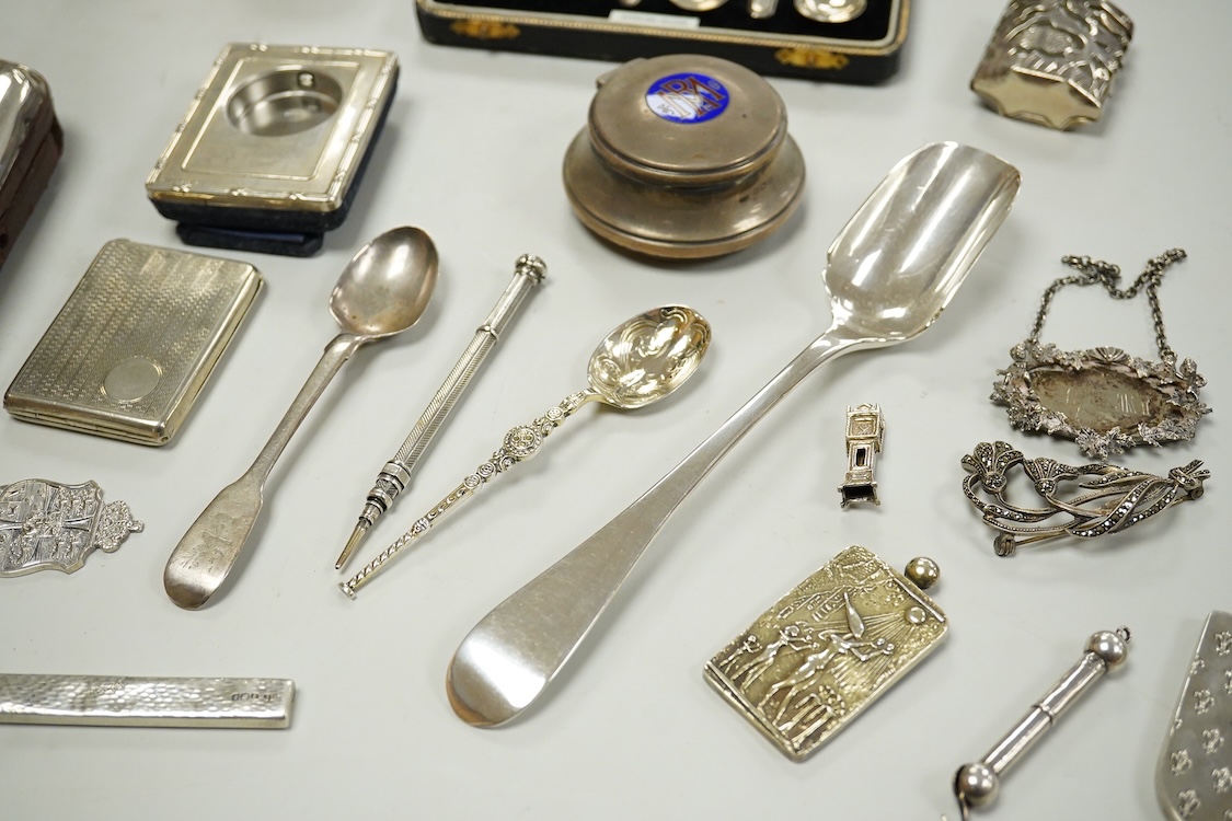 A collection of assorted small silver, including set of six 1930's coffee spoons, a mounted travelling pocket watch case, Victorian pepperette, mounted glass dwarf candlestick, enamelled powder box, Georgian stilton scoo